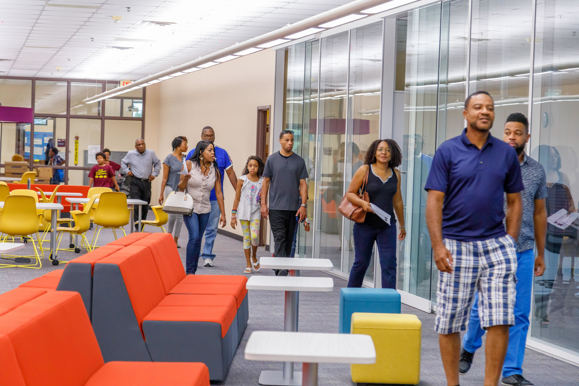 Parents walking through a school during an open house